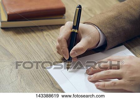 Man writing on paper View Large Photo Image Stock Photo - Man writing on paper. Fotosearch