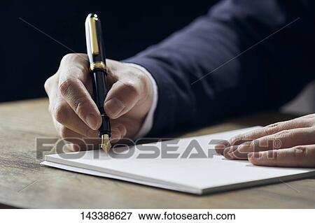 Man writing on paper View Large Photo Image Stock Photo - Man writing on paper. Fotosearch