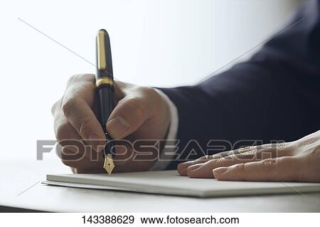 Man writing on paper View Large Photo Image Stock Photo - Man writing on paper. Fotosearch