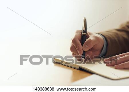 Man writing on paper View Large Photo Image Stock Photo - Man writing on paper. Fotosearch