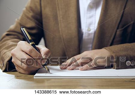 Man writing on paper View Large Photo Image Stock Photography - Man writing on paper. Fotosearch
