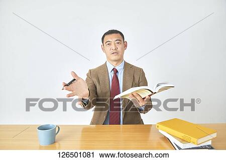 Stock Image - Mature Japanese businessman. Fotosearch