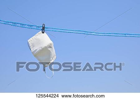 Picture - Medical masks drying in the sun. Fotosearch