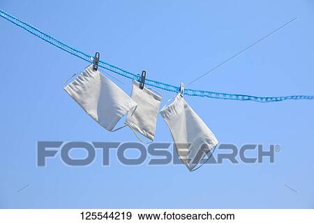 Medical masks drying in the sun View Large Photo Image Stock Photo - Medical masks drying in the sun. Fotosearch