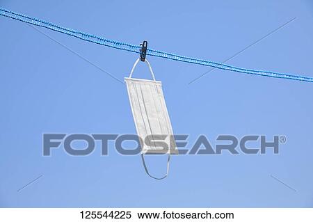 Stock Photography - Medical masks drying in the sun. Fotosearch