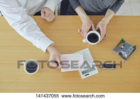 Stock Photography - Middle Aged Couple In The Room. Fotosearch