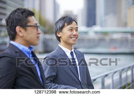 Stock Photo - Middle Aged Japanese Businessmen Portrait. Fotosearch