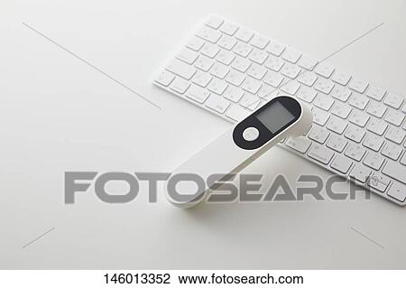 Stock Image - Non-contact thermometer. Fotosearch