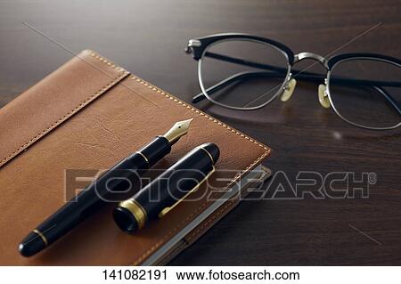 Stock Image - Notebook And Fountain Pen. Fotosearch
