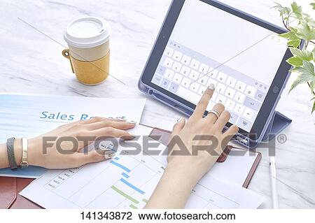 Stock Image - Paper Work With A Tablet PC. Fotosearch