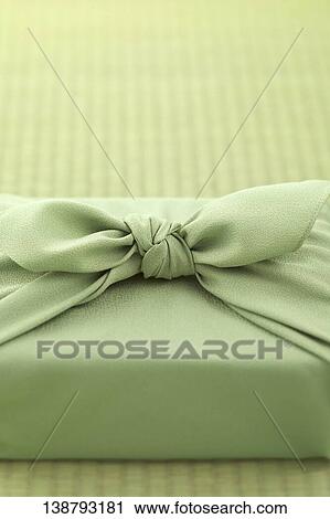 Stock Image - Parcel Wrapped In Japanese Wrapping Cloth. Fotosearch