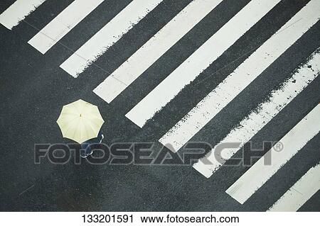 People Crossing A Crossroad On A Rainy Day In Tokyo, Japan View Large Photo Image Stock Image - People Crossing A Crossroad On A Rainy Day In Tokyo, Japan. Fotosearch