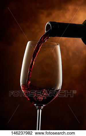 Pouring wine in a glass View Large Photo Image Stock Image - Pouring wine in a glass. Fotosearch