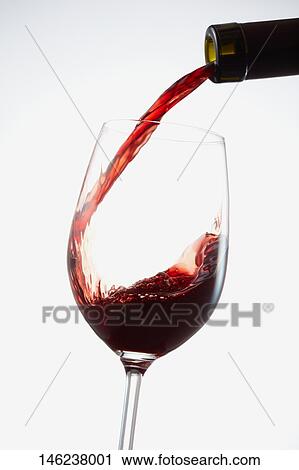 Pouring wine in a glass View Large Photo Image Stock Image - Pouring wine in a glass. Fotosearch