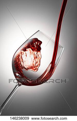 Pouring wine in a glass View Large Photo Image Stock Photo - Pouring wine in a glass. Fotosearch
