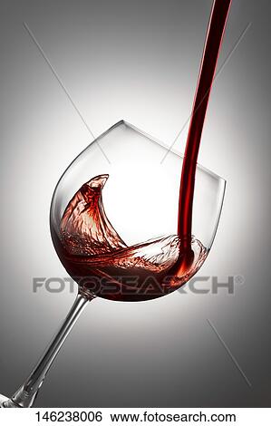 Pouring wine in a glass View Large Photo Image Stock Photograph - Pouring wine in a glass. Fotosearch