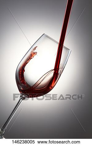 Pouring wine in a glass View Large Photo Image Stock Photography - Pouring wine in a glass. Fotosearch