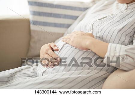 Pregnant Japanese woman View Large Photo Image Picture - Pregnant Japanese woman. Fotosearch