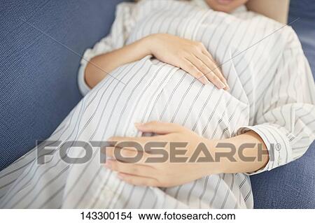 Pregnant Japanese woman View Large Photo Image Picture - Pregnant Japanese woman. Fotosearch