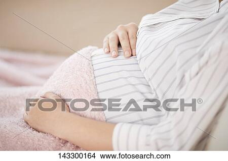 Pregnant Japanese woman View Large Photo Image Picture - Pregnant Japanese woman. Fotosearch