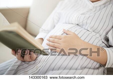 Stock Image - Pregnant Japanese woman. Fotosearch