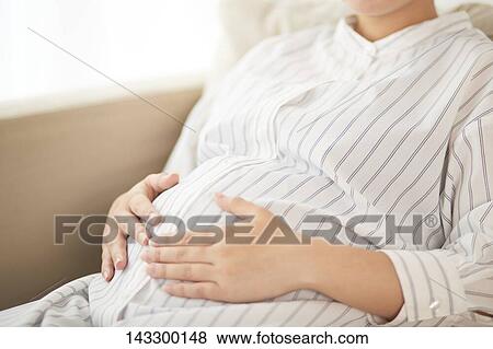 Pregnant Japanese woman View Large Photo Image Stock Photo - Pregnant Japanese woman. Fotosearch