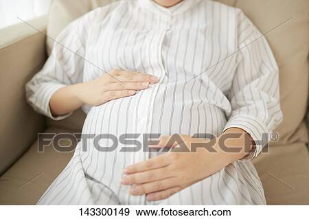 Stock Photo - Pregnant Japanese woman. Fotosearch