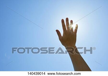 Picture - Raised Hand To The Sky. Fotosearch