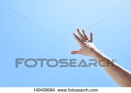Raised Hand To The Sky View Large Photo Image Picture - Raised Hand To The Sky. Fotosearch