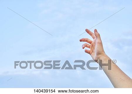 Raised Hand To The Sky View Large Photo Image Picture - Raised Hand To The Sky. Fotosearch