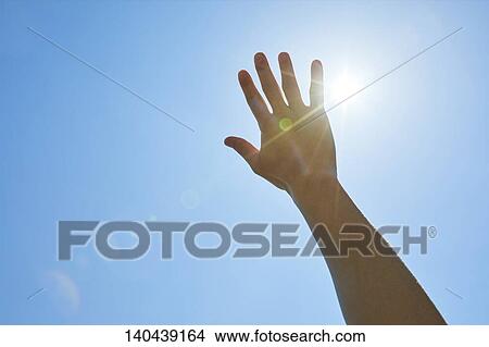 Picture - Raised Hand To The Sky. Fotosearch