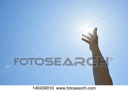 Stock Image - Raised Hand To The Sky. Fotosearch