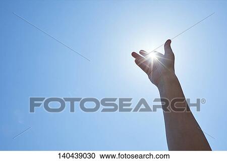 Stock Image - Raised Hand To The Sky. Fotosearch