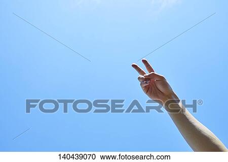 Stock Image - Raised Hand To The Sky. Fotosearch
