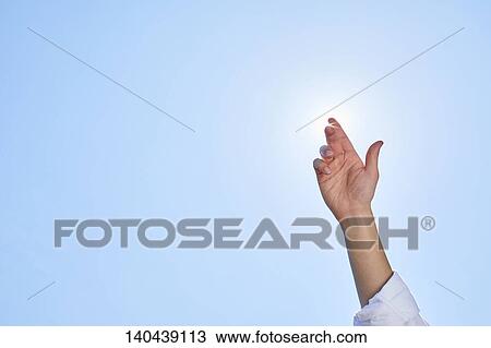 Stock Image - Raised Hand To The Sky. Fotosearch