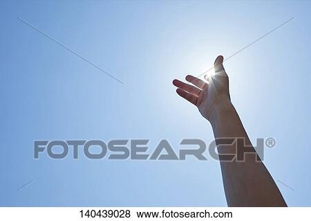 Stock Photo - Raised Hand To The Sky. Fotosearch