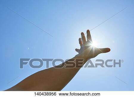 Stock Photograph - Raised Hand To The Sky. Fotosearch