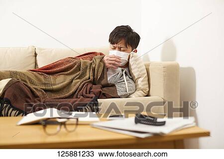 Sick Japanese man at home View Large Photo Image Stock Image - Sick Japanese man at home. Fotosearch
