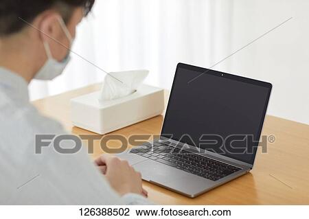 Sick Japanese man working from home View Large Photo Image Stock Image - Sick Japanese man working from home. Fotosearch