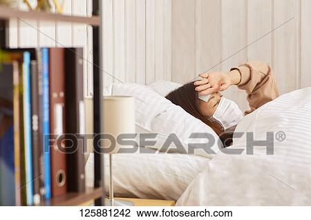 Sick Japanese woman at home View Large Photo Image Stock Image - Sick Japanese woman at home. Fotosearch