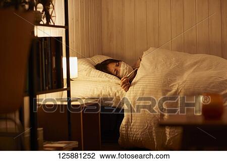 Sick Japanese woman at home View Large Photo Image Stock Image - Sick Japanese woman at home. Fotosearch