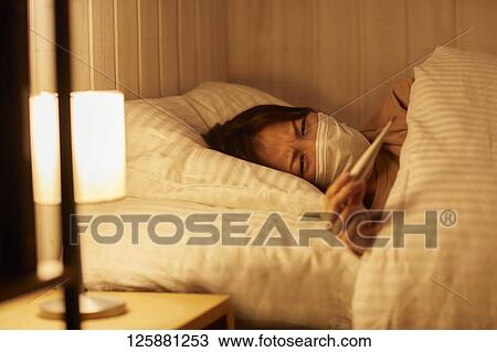 Sick Japanese woman at home View Large Photo Image Stock Image - Sick Japanese woman at home. Fotosearch