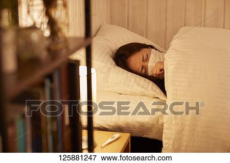 Sick Japanese woman at home View Large Photo Image Stock Photo - Sick Japanese woman at home. Fotosearch