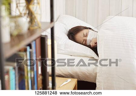 Sick Japanese woman at home View Large Photo Image Stock Photo - Sick Japanese woman at home. Fotosearch