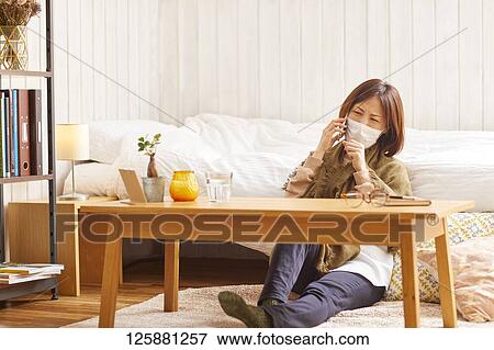 Sick Japanese woman at home View Large Photo Image Stock Photo - Sick Japanese woman at home. Fotosearch