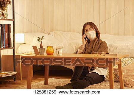 Sick Japanese woman at home View Large Photo Image Stock Photo - Sick Japanese woman at home. Fotosearch