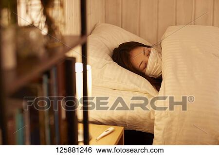 Sick Japanese woman at home View Large Photo Image Stock Photograph - Sick Japanese woman at home. Fotosearch