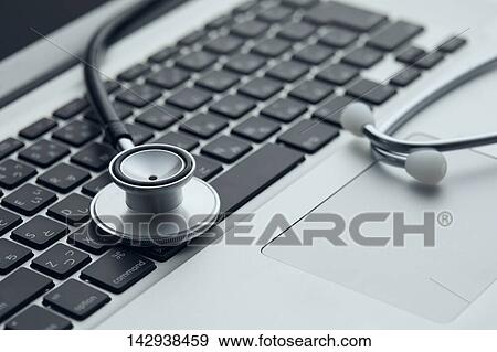 Stethoscope and laptop View Large Photo Image Stock Photo - Stethoscope and laptop. Fotosearch