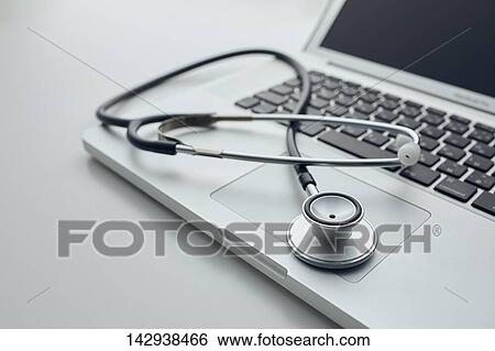 Stethoscope and laptop View Large Photo Image Stock Photograph - Stethoscope and laptop. Fotosearch