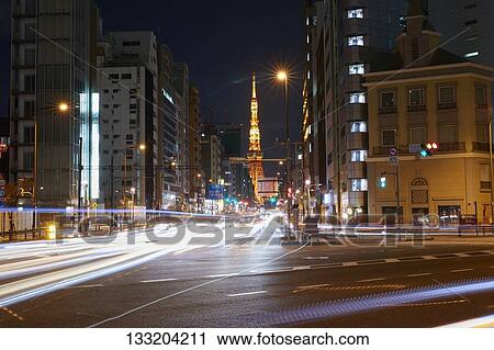 Stock Image - Streets In Tokyo At Night, Japan. Fotosearch
